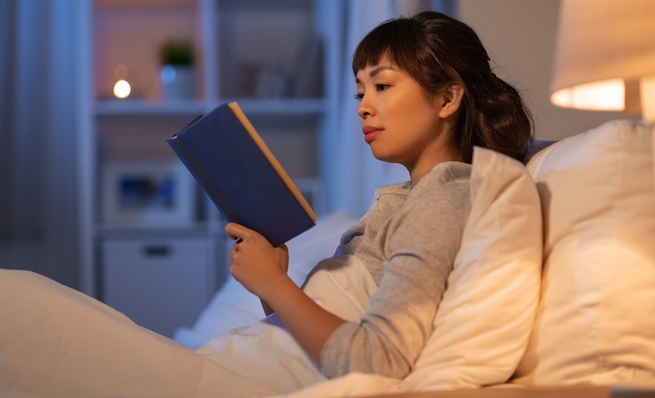 person reading in bed