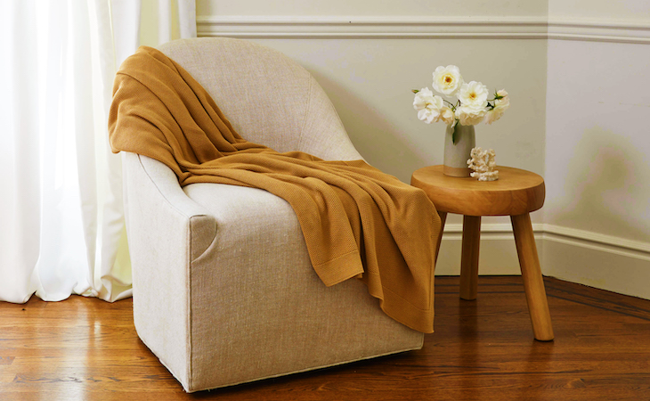 saatva reading chair with sweater knit blanket