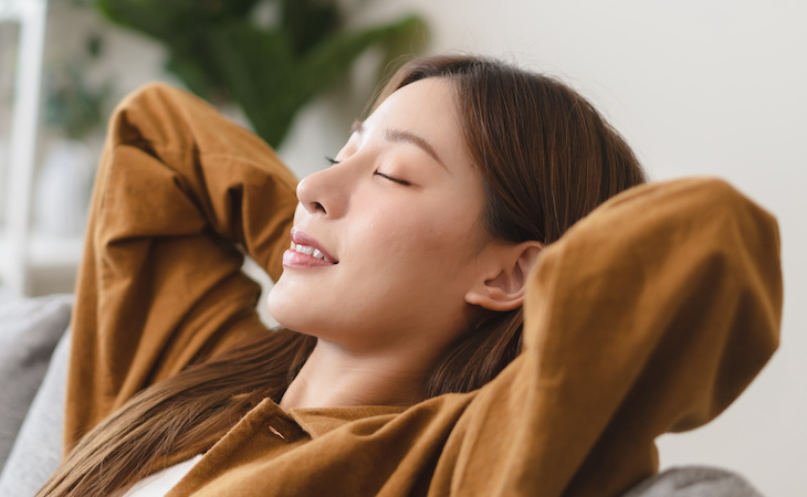 person dreaming and relaxing on the couch