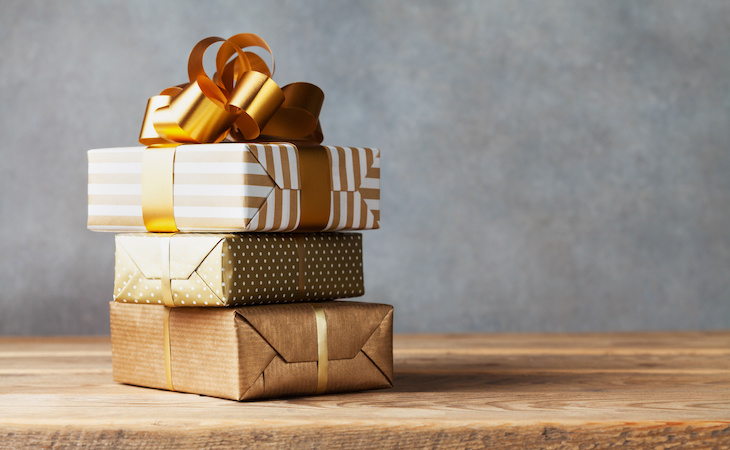 stack of wrapped holiday gift boxed