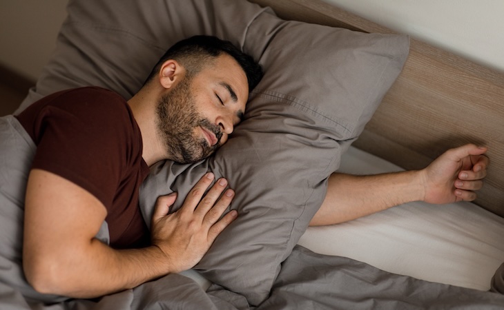 person sleeping in bed at home